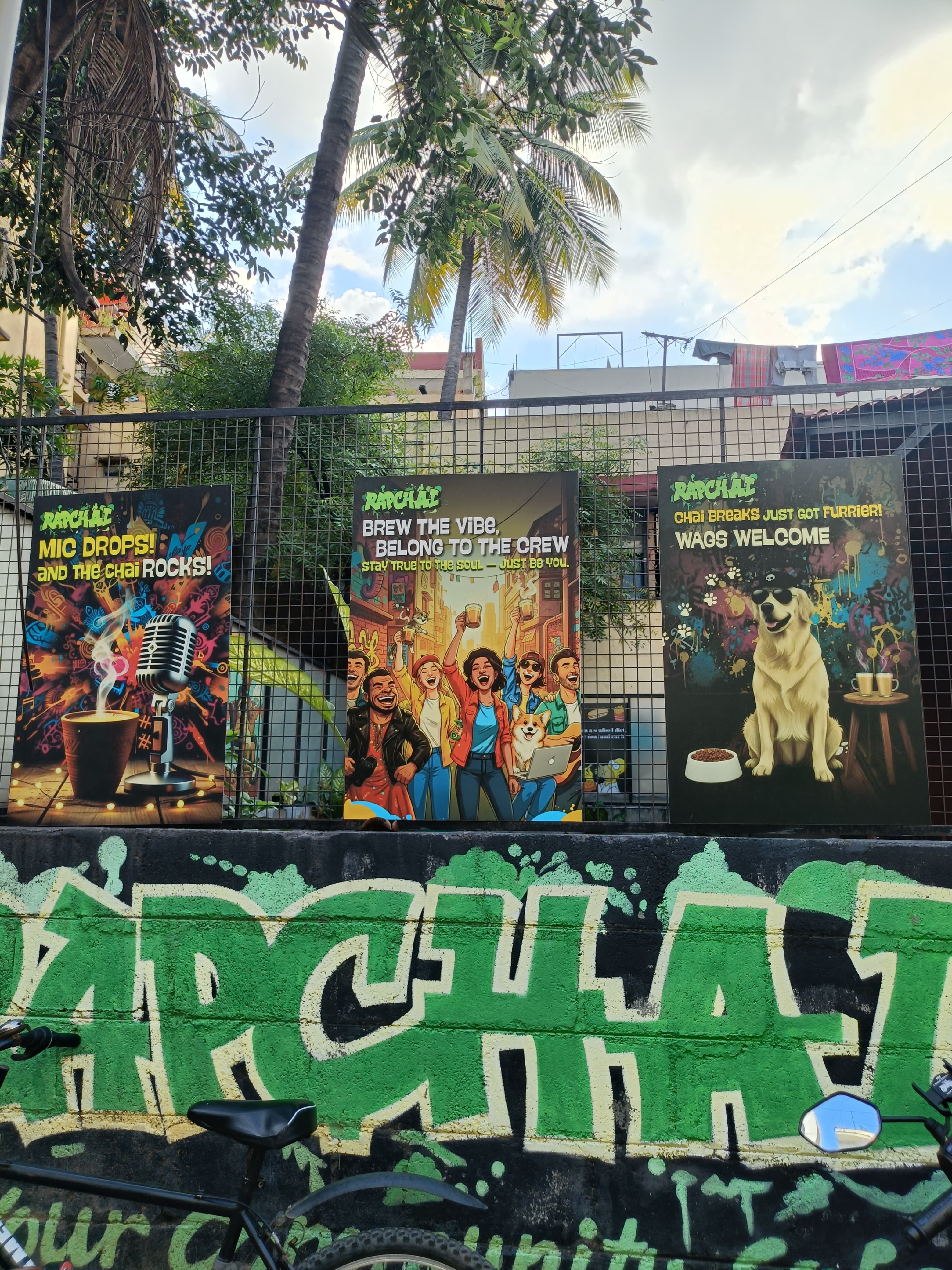 Rapchai street wall with community posters and graffiti